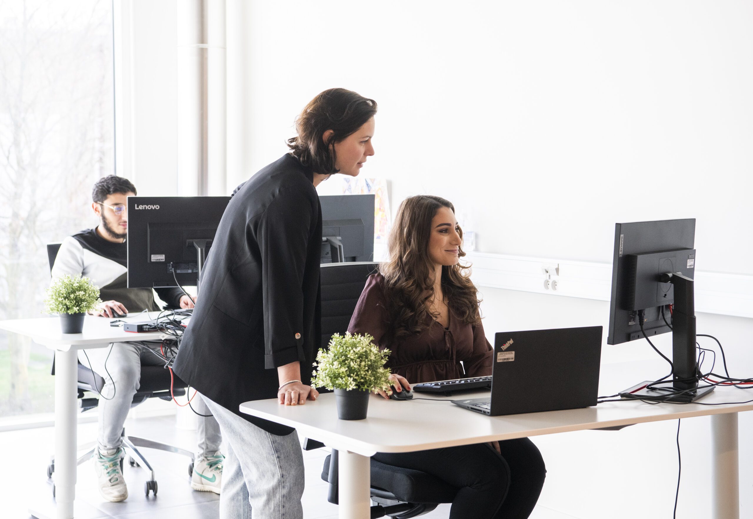 People looking at screen at Resillion Hasselt office