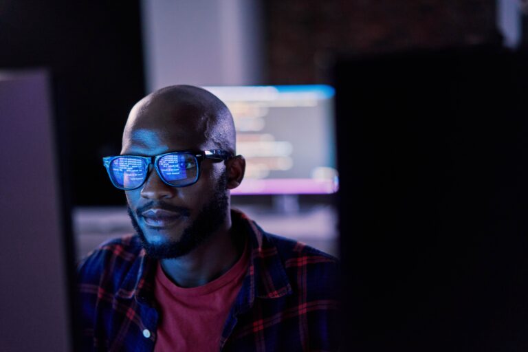 Man at laptop looking at digital assurance