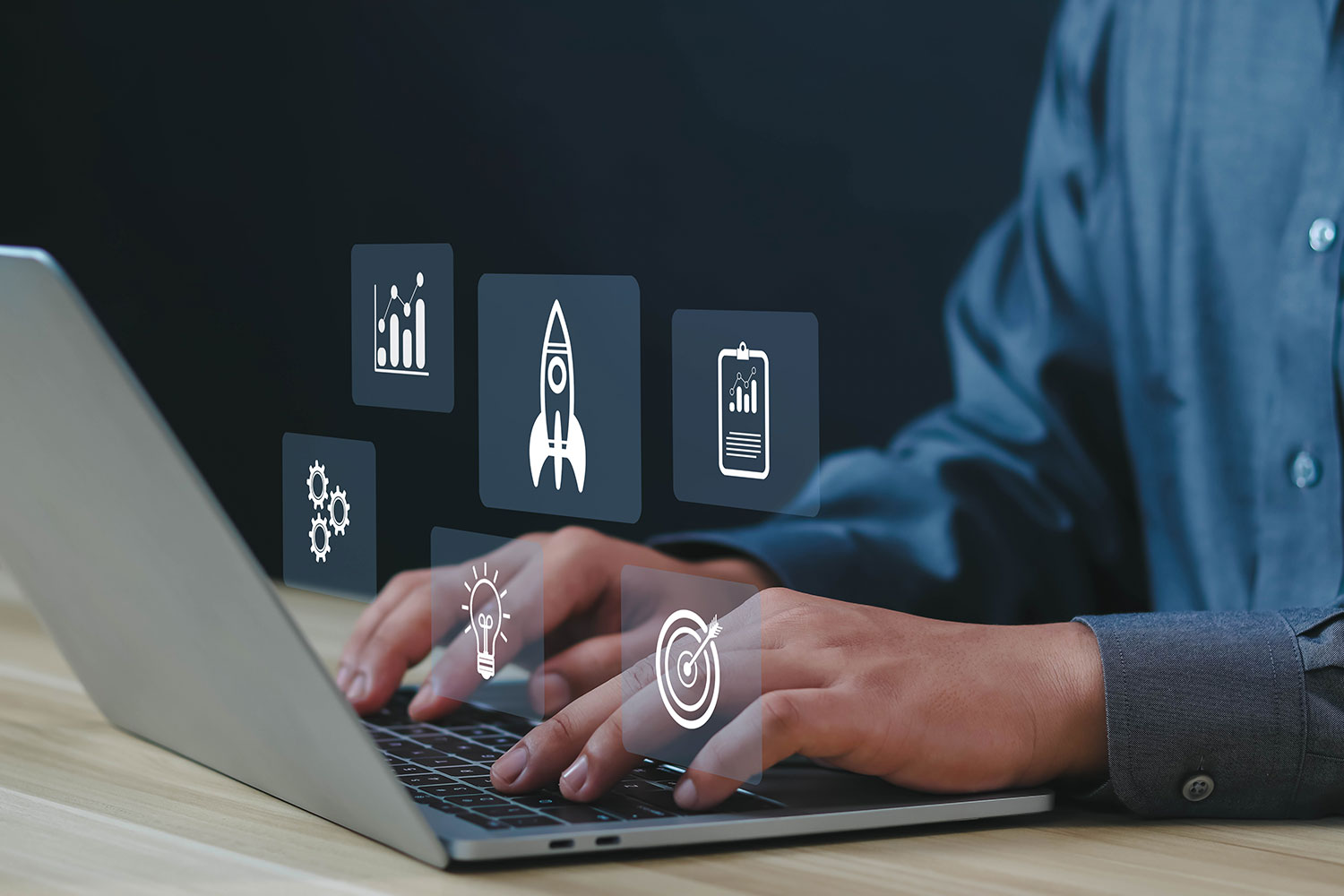 Developer on laptop with digital icons representing fast and accessible UX usability testing solutions