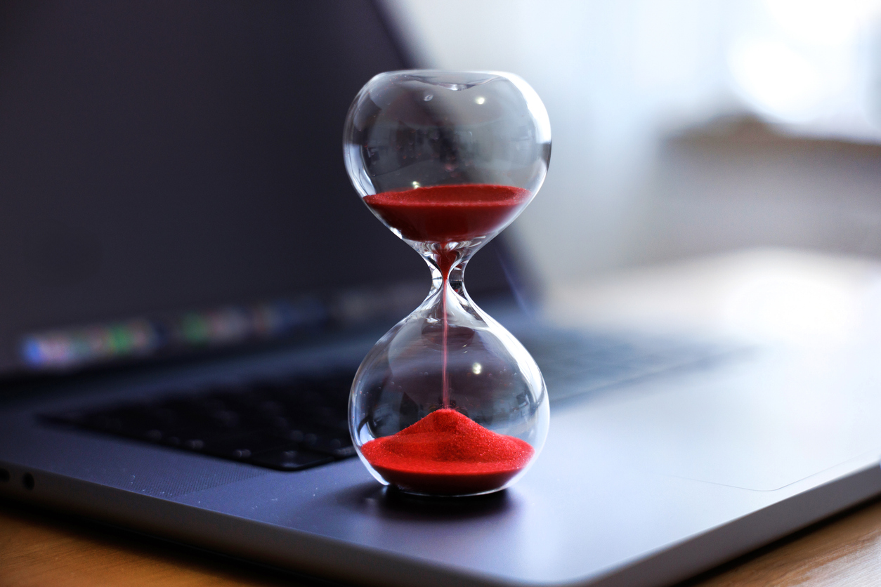 Hourglass on a laptop representing faster automated testing for web and mobile applications
