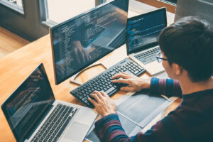 Developer writing critical infrastructure security and cybersecurity testing code