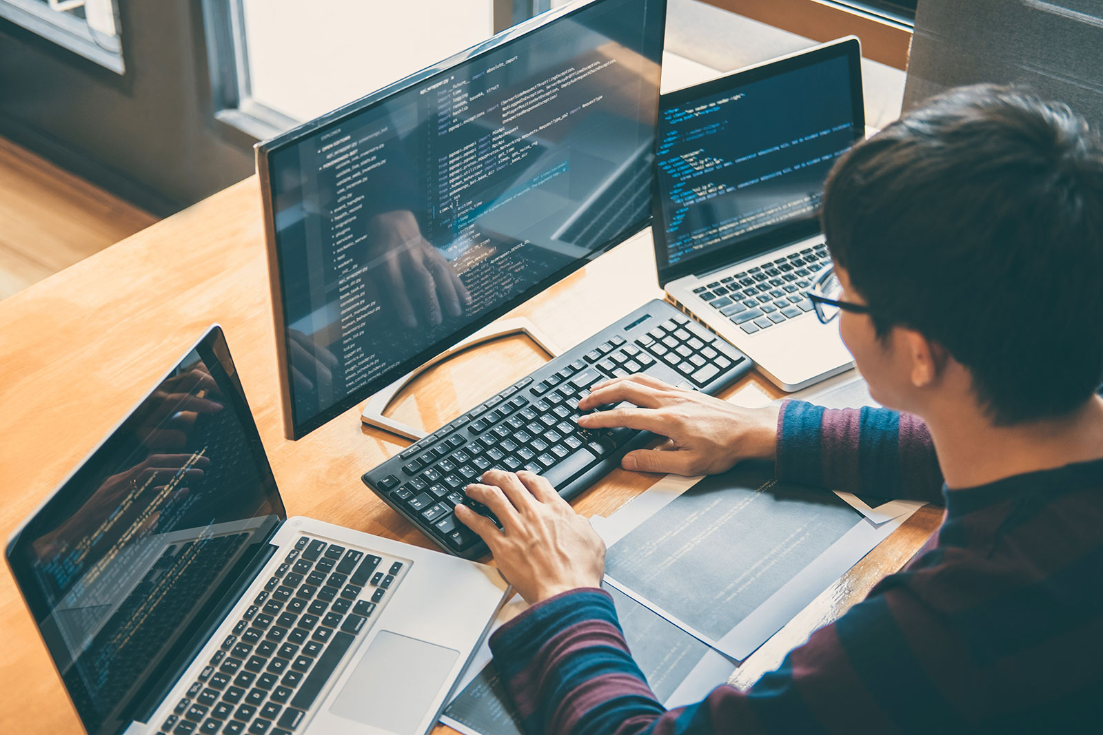 Developer writing critical infrastructure security and cybersecurity testing code