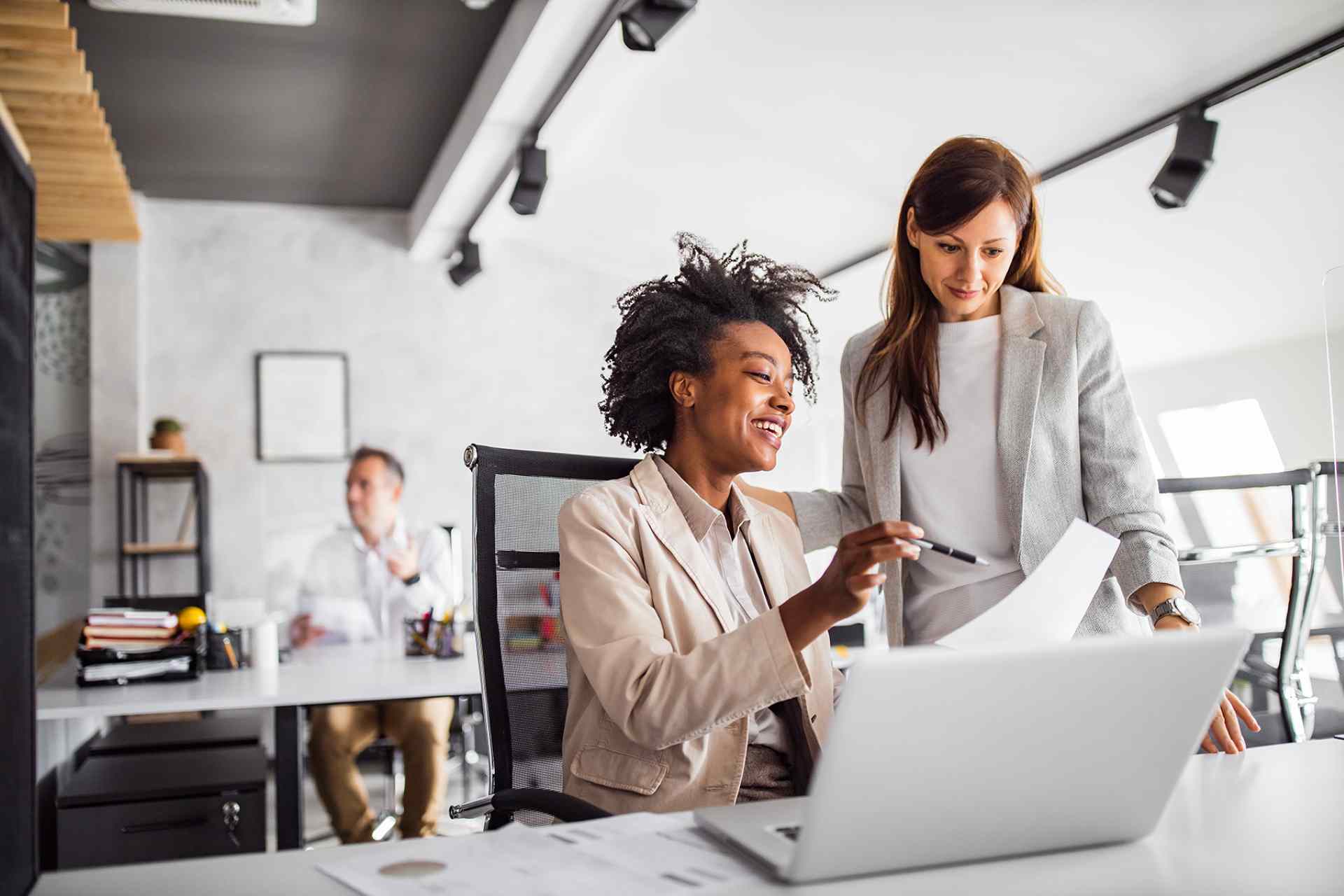 Two professionals reviewing digital assurance and software QA solutions together