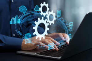 Developer on laptop with digital gears and icons representing automated cross-platform app testing