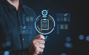 Professional holding magnifying glass over virtual audit checklist for ERP quality assurance