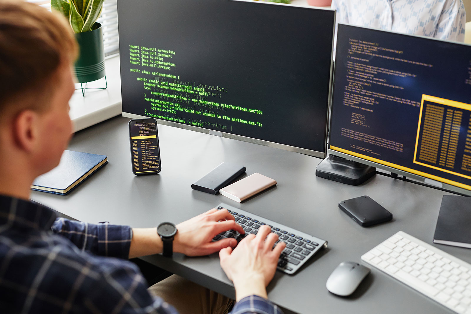 Developer writing HbbTV automation testing code with Ligada iSuite