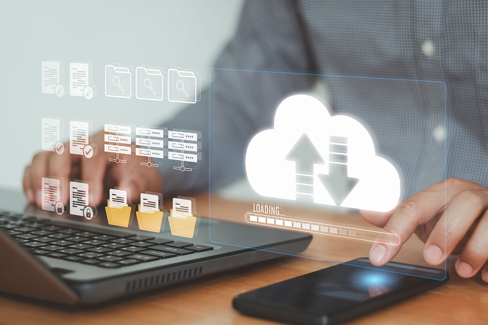 Professional using laptop with cloud data transfer icons for ERP system integration