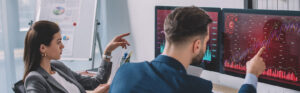 QA experts reviewing digital experience testing data and software quality assurance metrics