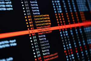Test automation script execution logs on screen representing automated regression testing and QA automation services