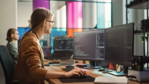 Developer testing cyber resilience act compliance on multiple monitors