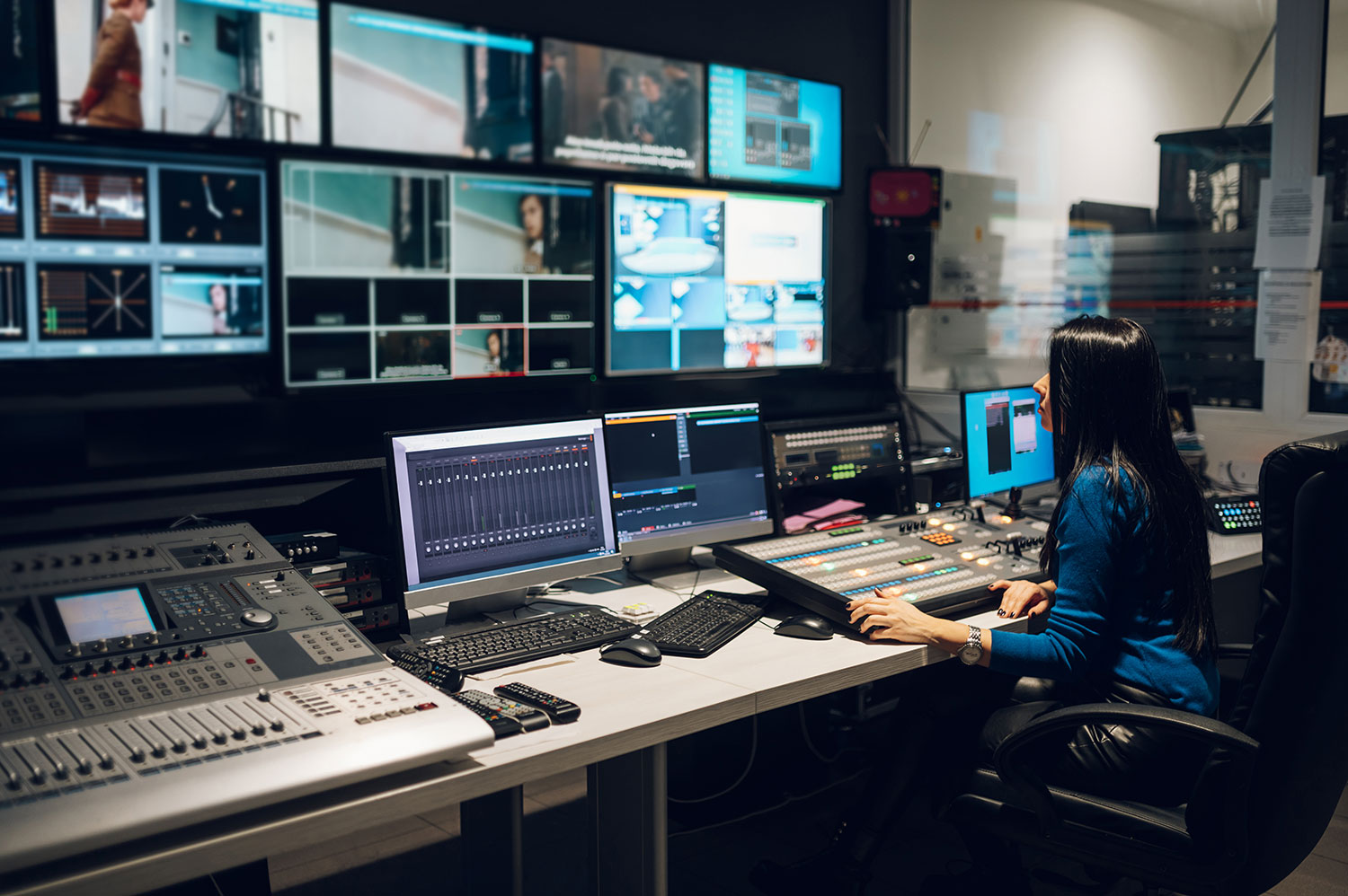 Engineer monitoring HbbTV broadcast streams and Ligada iSuite in control room