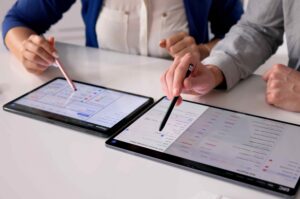 People-testing-business-process-on-tablets