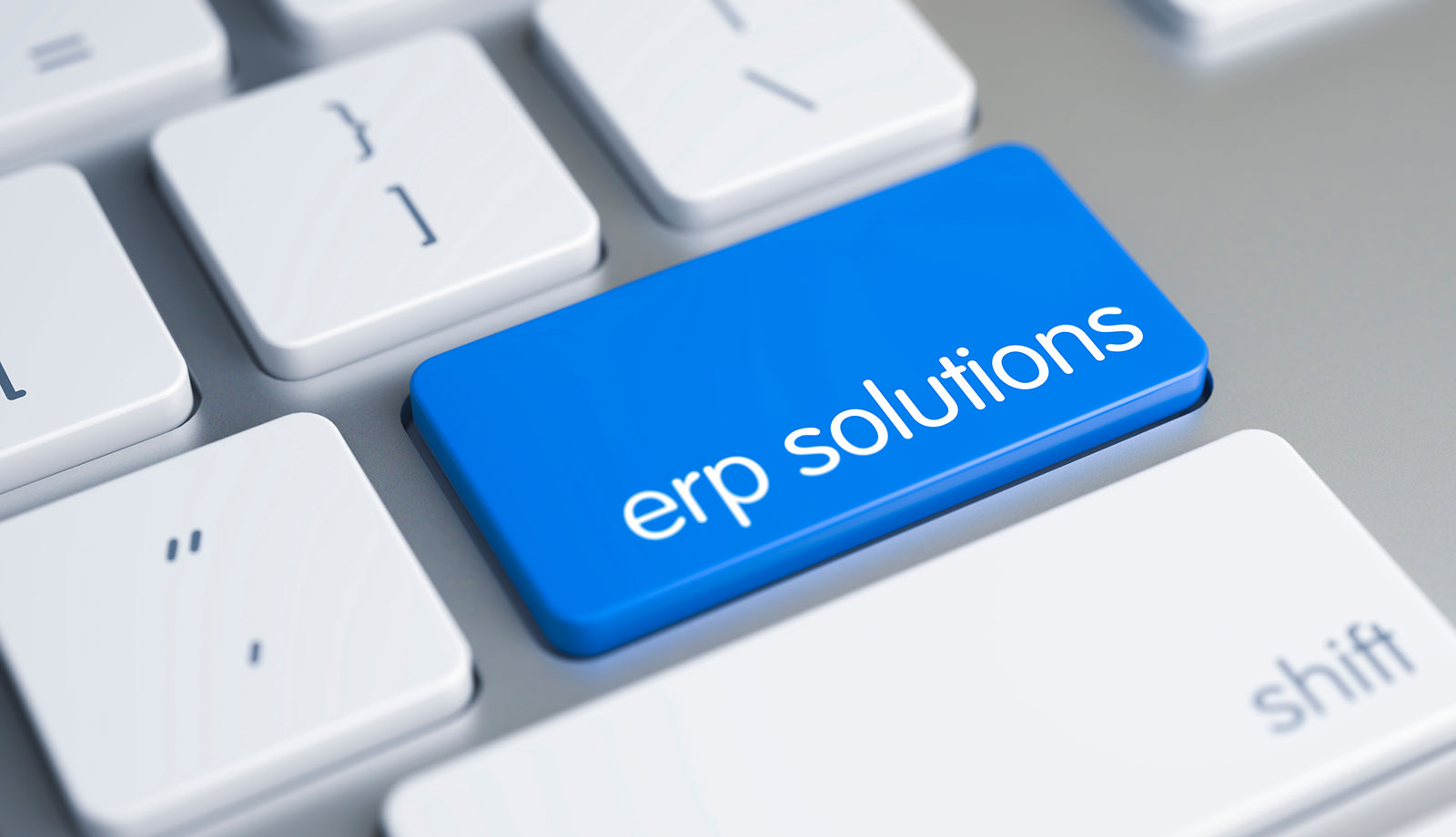 Keyboard with blue ERP solutions button highlighting enterprise resource planning
