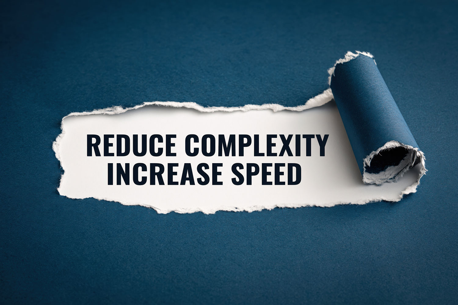 Blue torn paper uncovering a message about reducing complexity and increasing speed