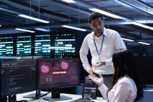 Engineers monitoring electricity network operations in control center