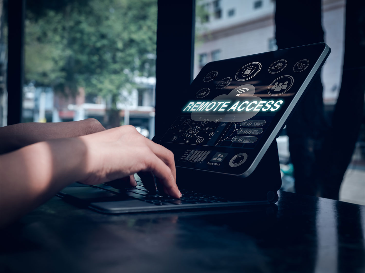 Person using laptop with remote access screen representing digital accessibility testing services