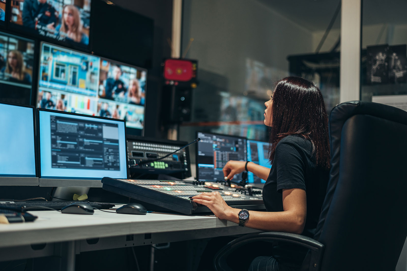 Engineer monitoring HbbTV broadcast streams and Ligada iSuite testing dashboard
