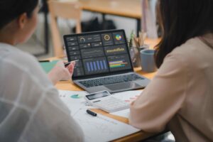 Women-checking-business-automation-statistics-on-computer