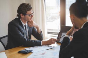 Executives discussing AI governance risk compliance and responsible AI advisory solutions