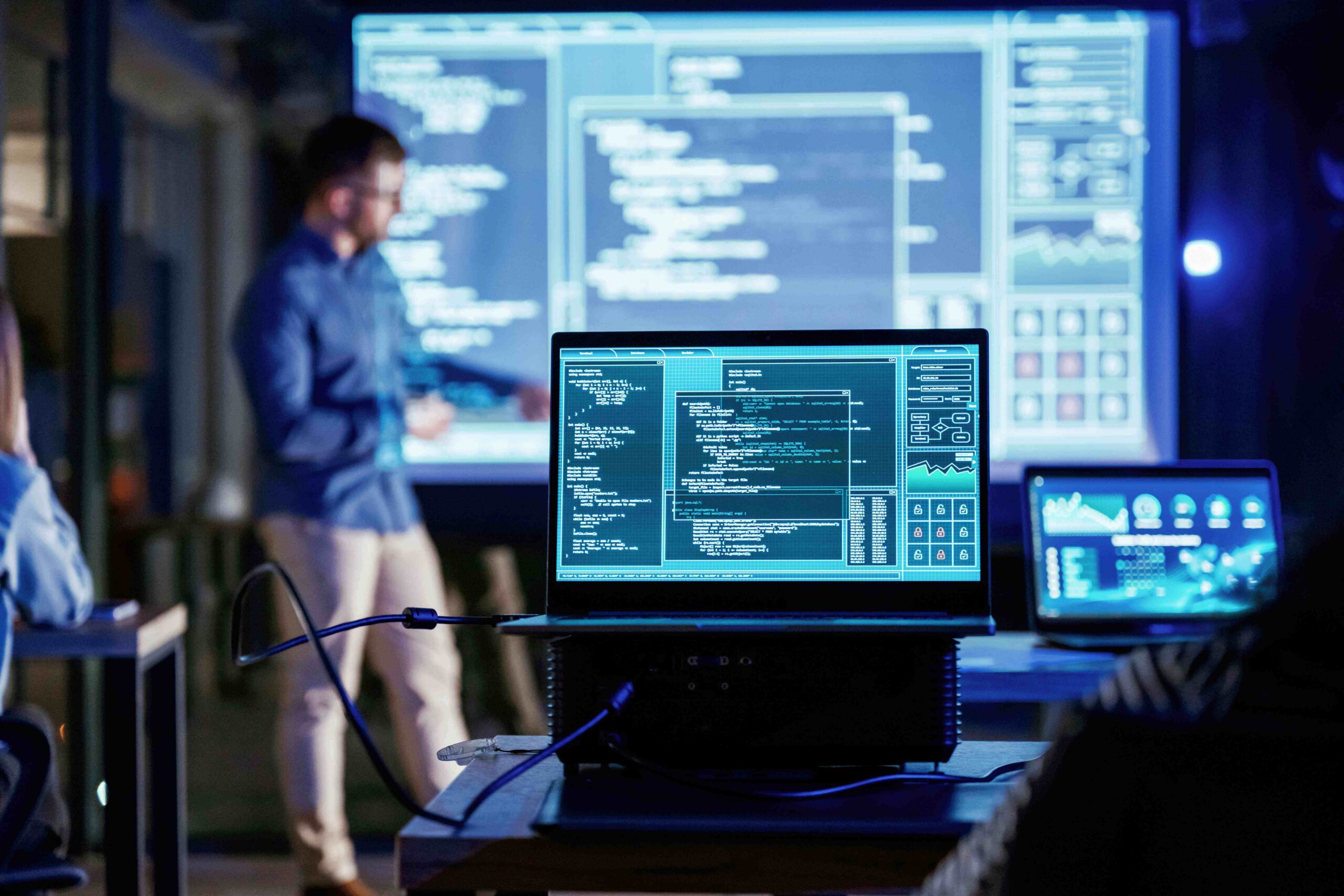 Software engineer monitoring automated testing and development