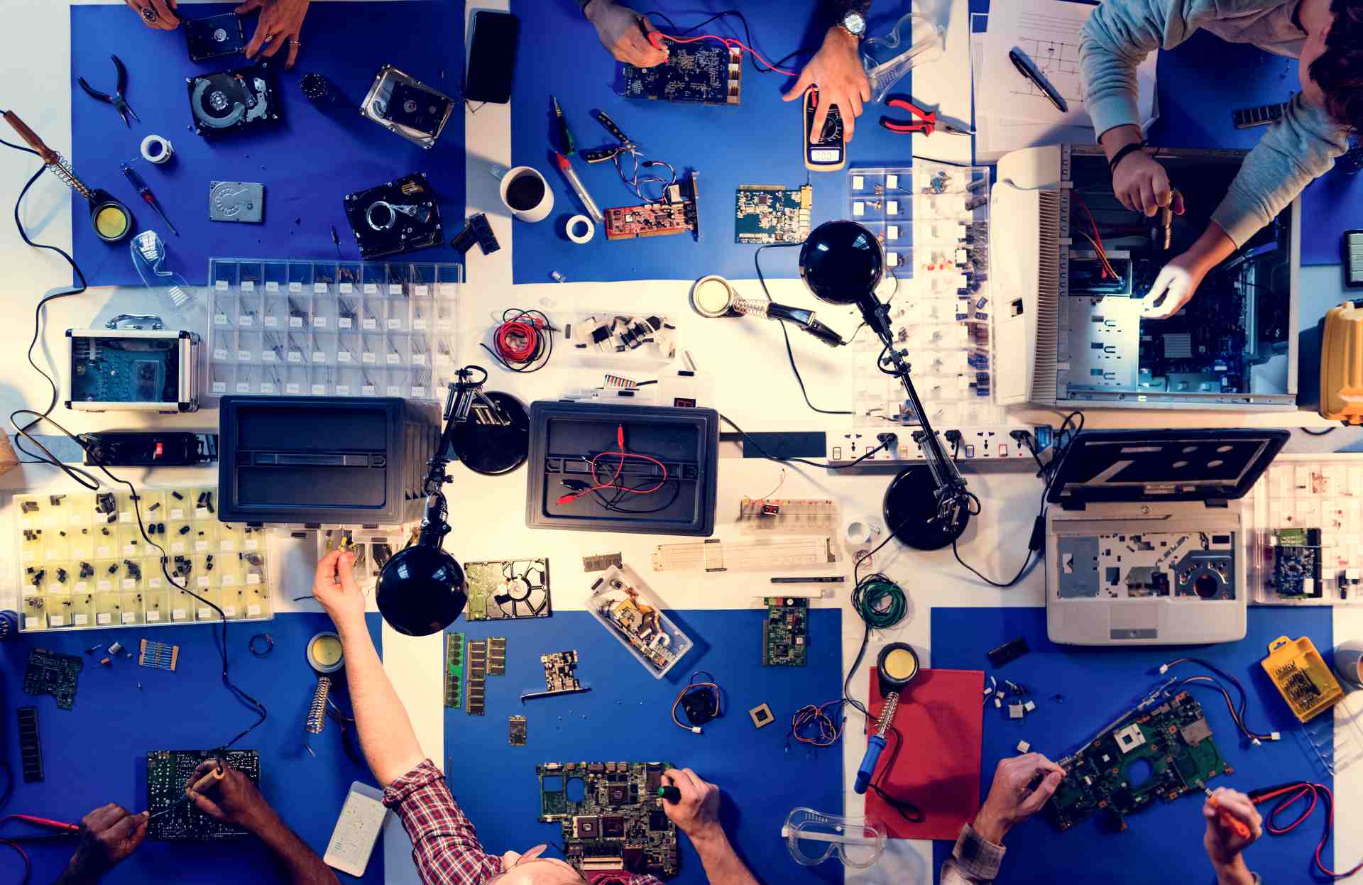 Engineers conducting hardware and AI model testing for total quality assurance and validation