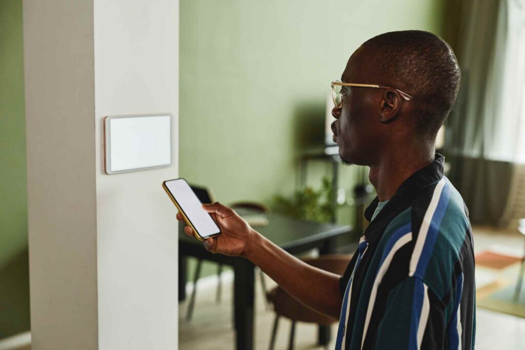 Black man using smart home system side view 2026 01 08 06 56 56 utc