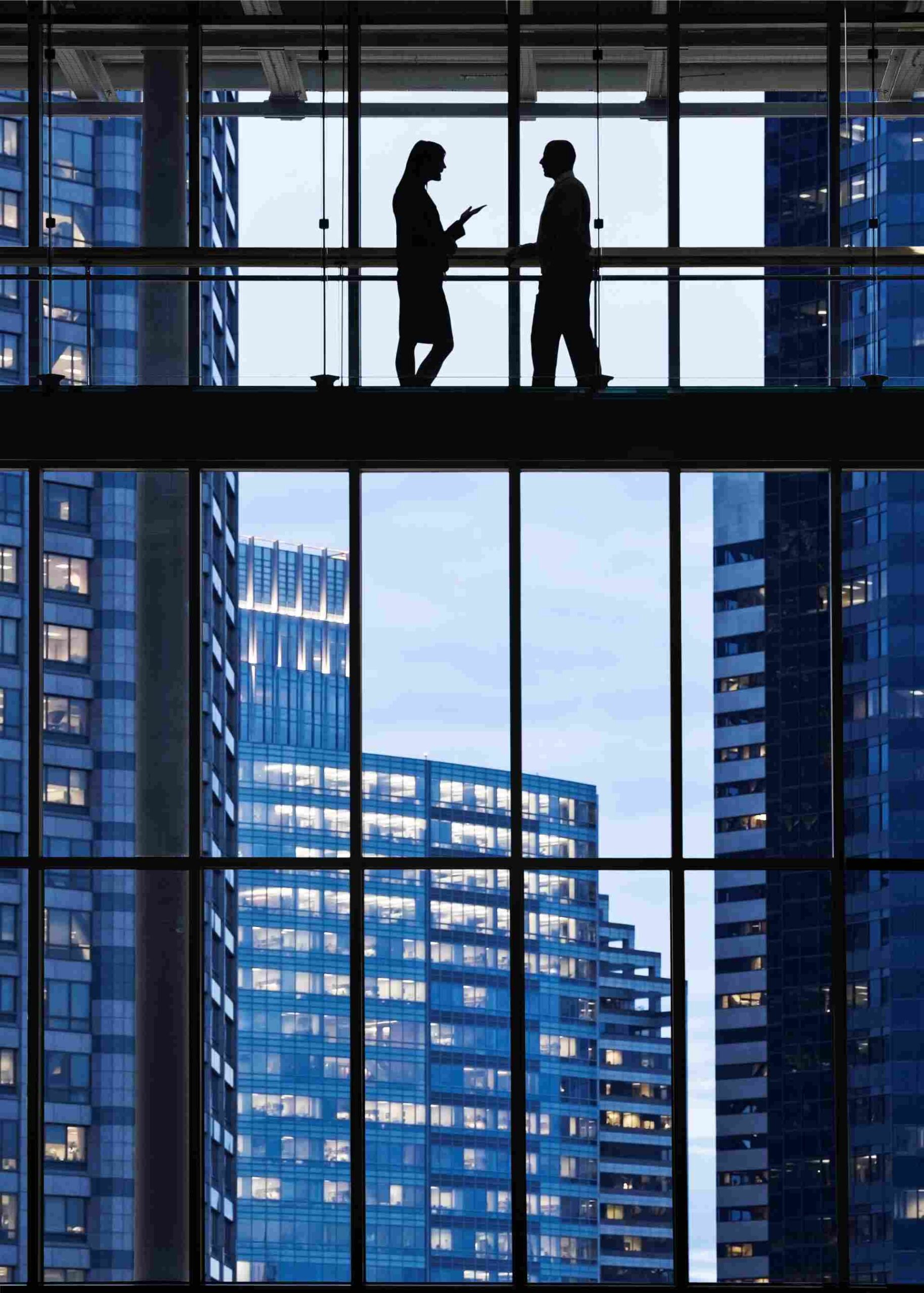 Business people meeting on an elevated walkway bet 2026 01 09 09 37 15 utc scaled