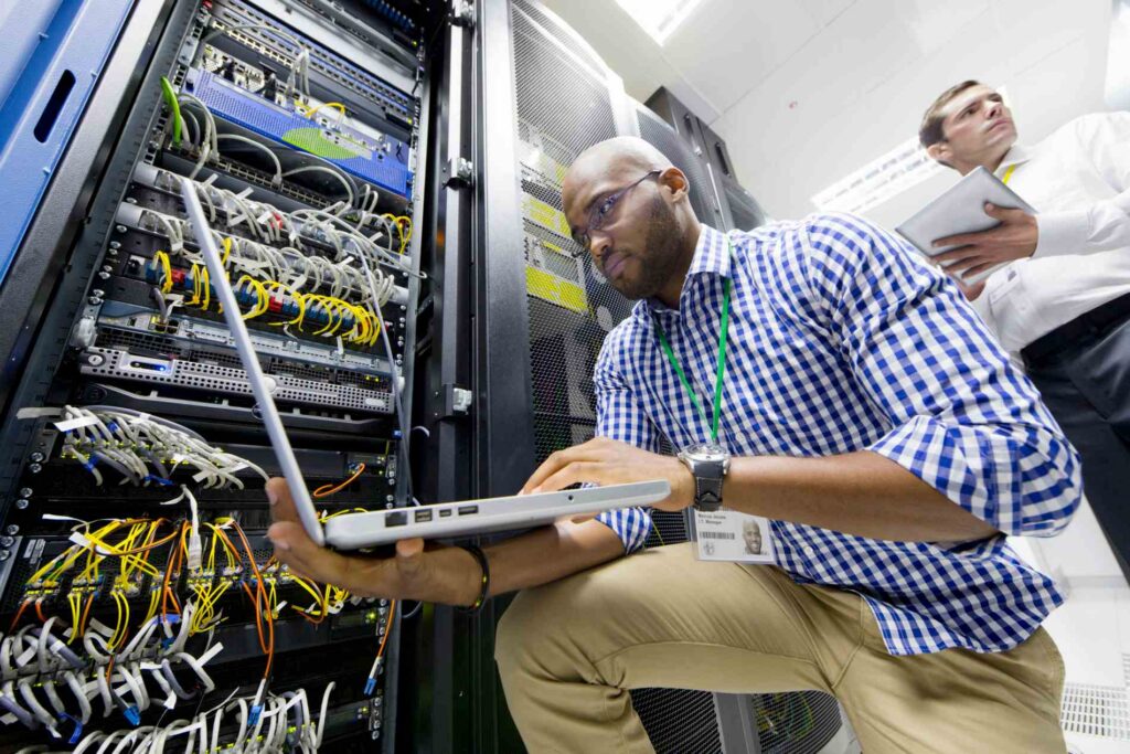 Close up of technicians with a laptop and a digita 2026 03 26 08 46 19 utc