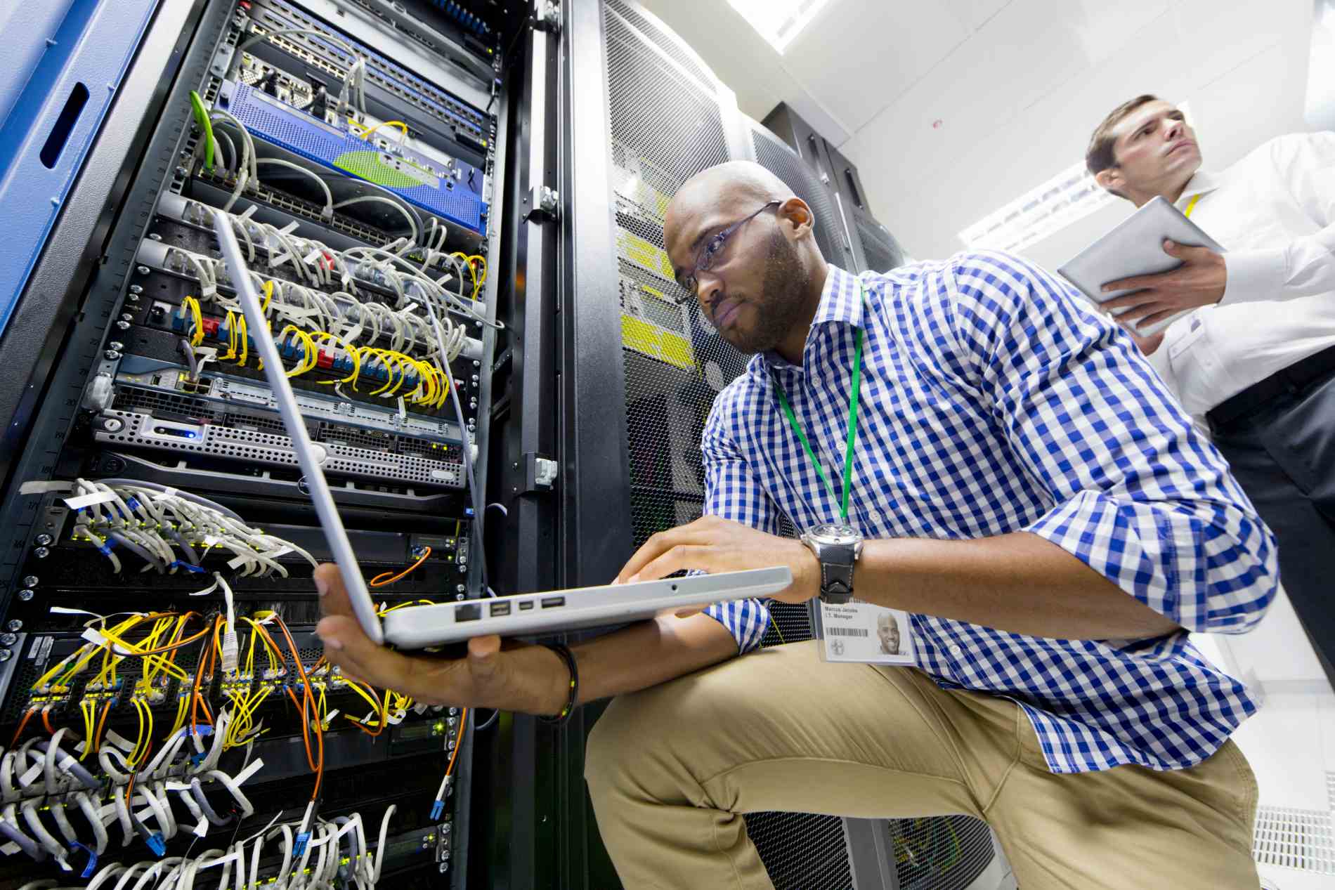 Close up of technicians with a laptop and a digita 2026 03 26 08 46 19 utc