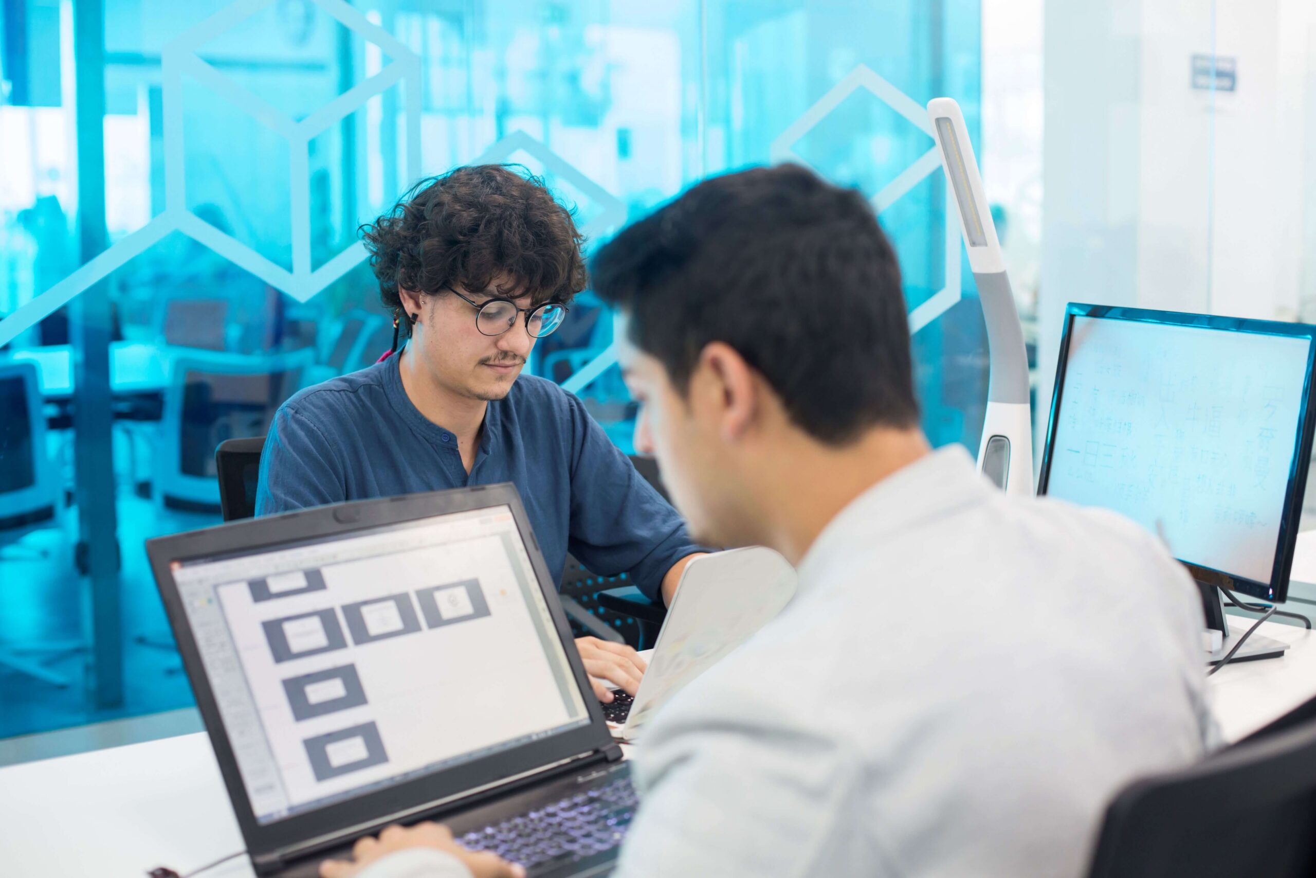 Certified software testing experts reviewing application workflows