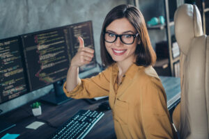Confident female QA engineer giving thumbs up representing successful automated testing services