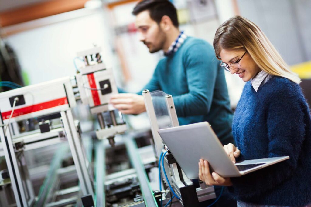 Engineers testing industrial equipment and systems