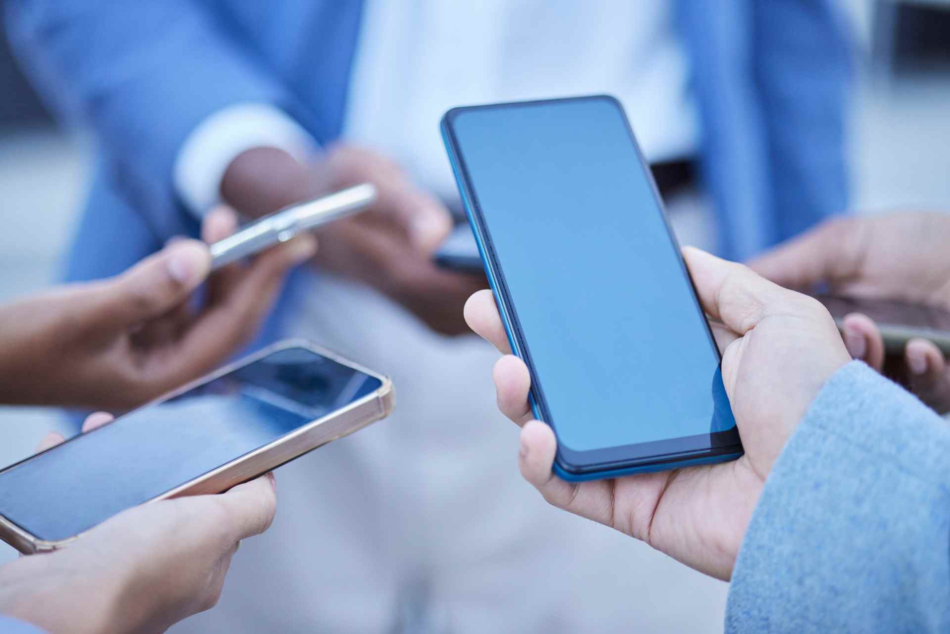 Group of professionals holding smartphones during 2026 03 25 02 35 06 utc
