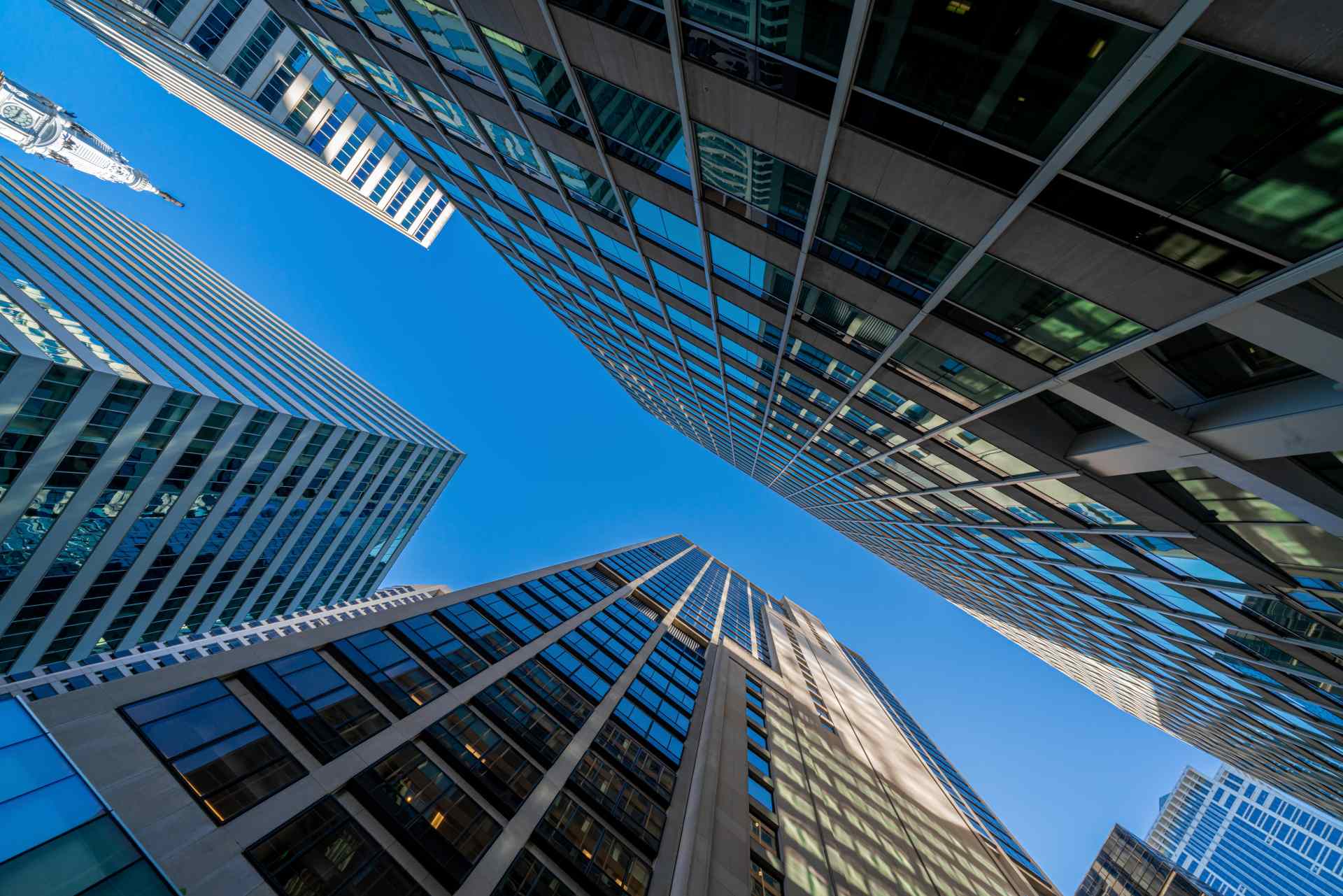 Corporate skyscrapers representing enterprise AI governance risk compliance and digital assurance services
