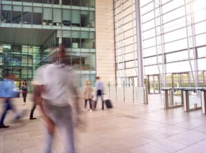 Motion blur shot of businesspeople in lobby of bus 2026 03 10 03 19 42 utc