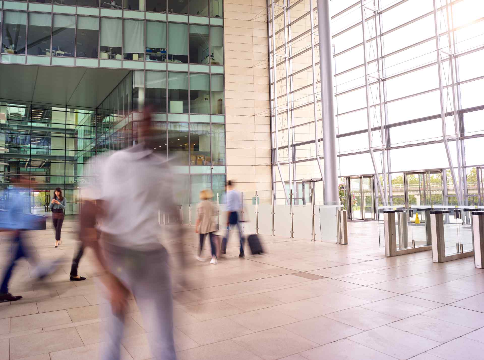 Motion blur shot of businesspeople in lobby of bus 2026 03 10 03 19 42 utc