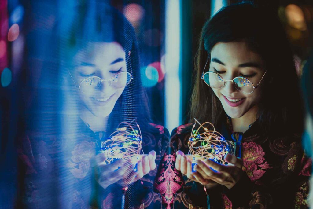 Women experiencing AI innovation representing responsible AI testing and quality assurance services