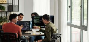 Developers collaborating on application performance and scalability testing solutions