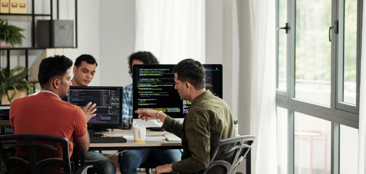 Developers collaborating on application performance and scalability testing solutions
