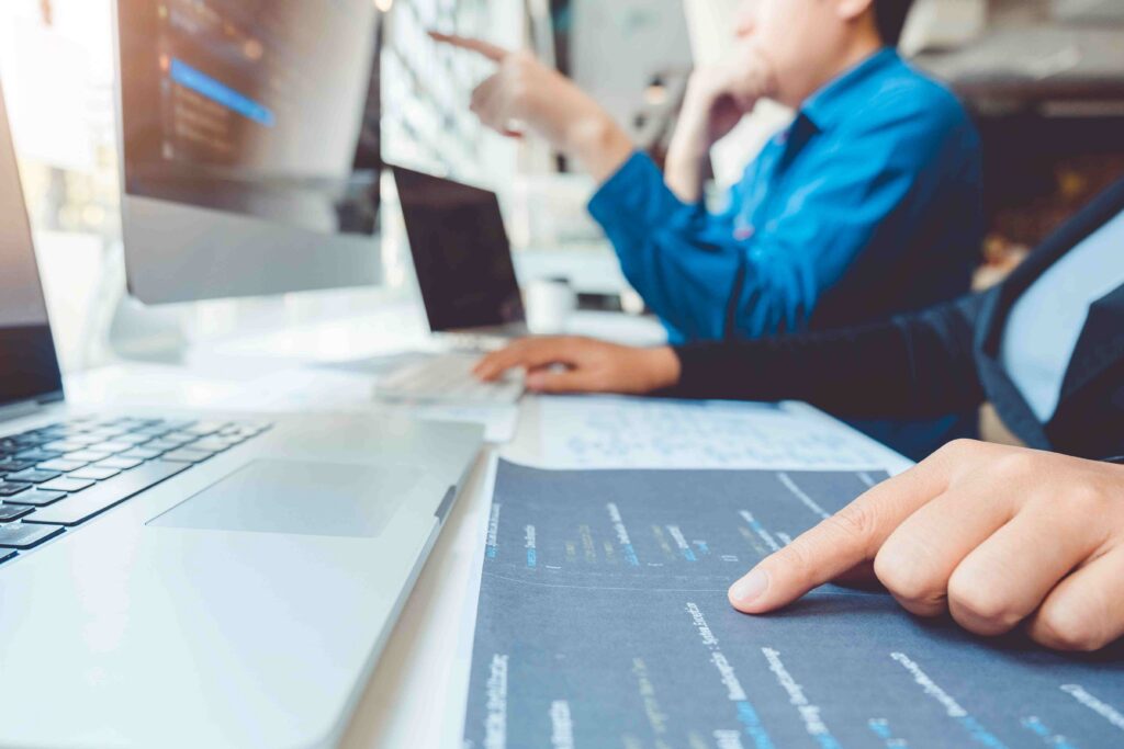Engineers analyzing software testing and application performance