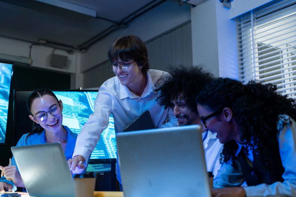 Testing team reviewing software environments together