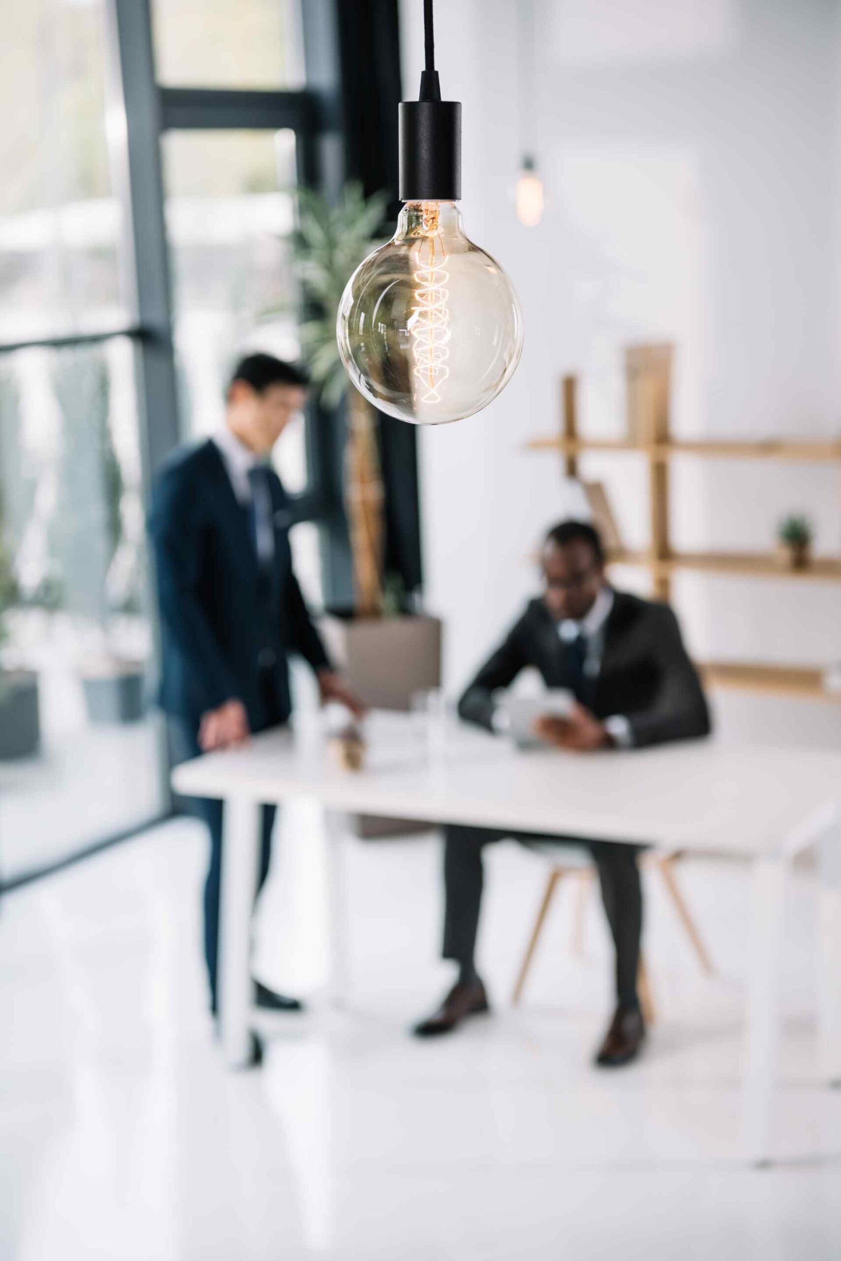 Vintage lamp with business colleagues sitting in m 2026 01 06 00 35 48 utc scaled