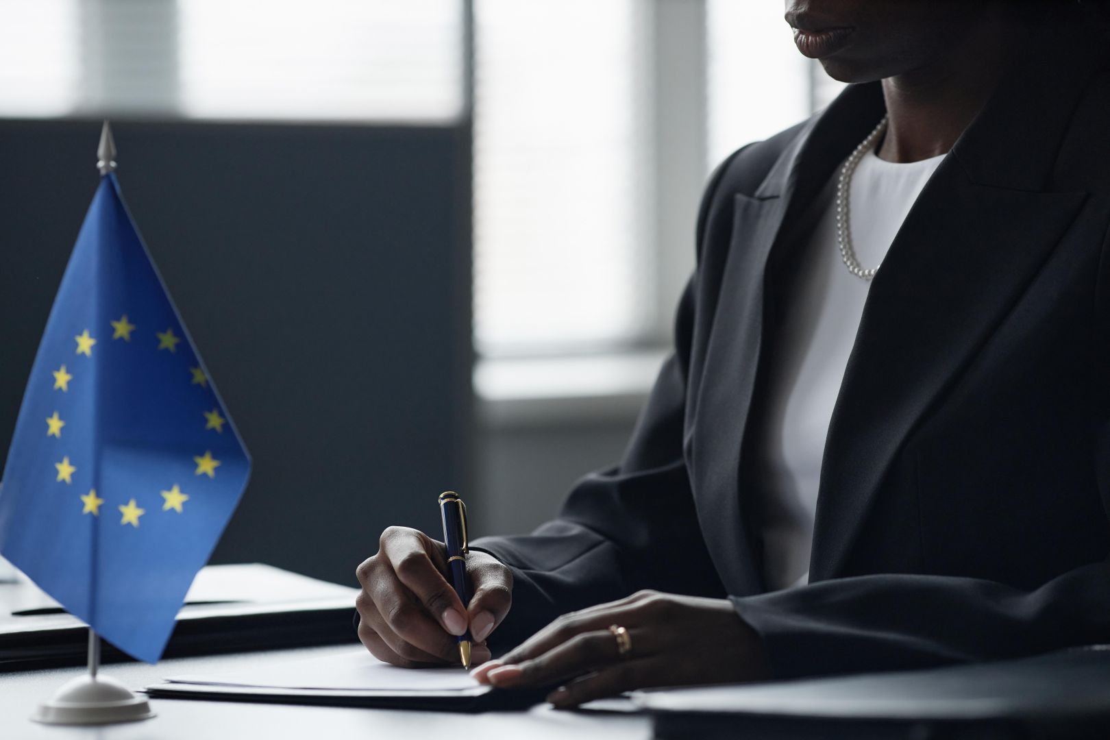 Woman signing GDPR compliance document