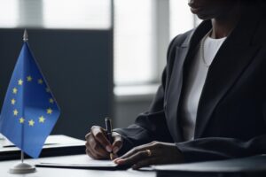 Professional signing AI compliance and regulation assurance documentation under EU governance standards