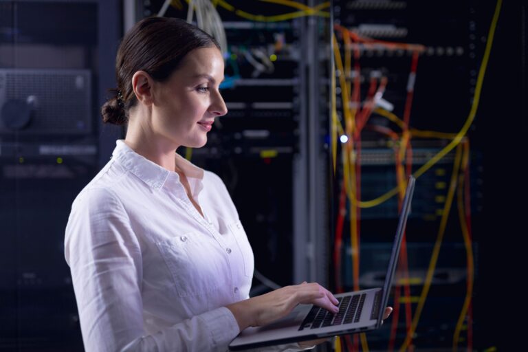Technology professional monitoring software systems and network infrastructure using a laptop in a server environment