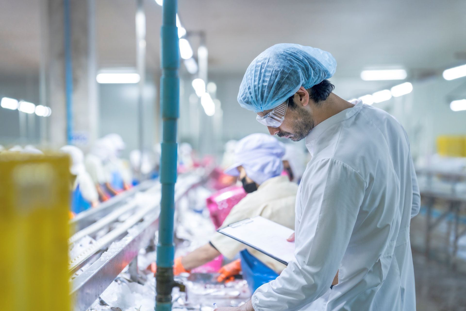Worker inspecting products in a factory setting 2026 01 09 11 44 12 utc
