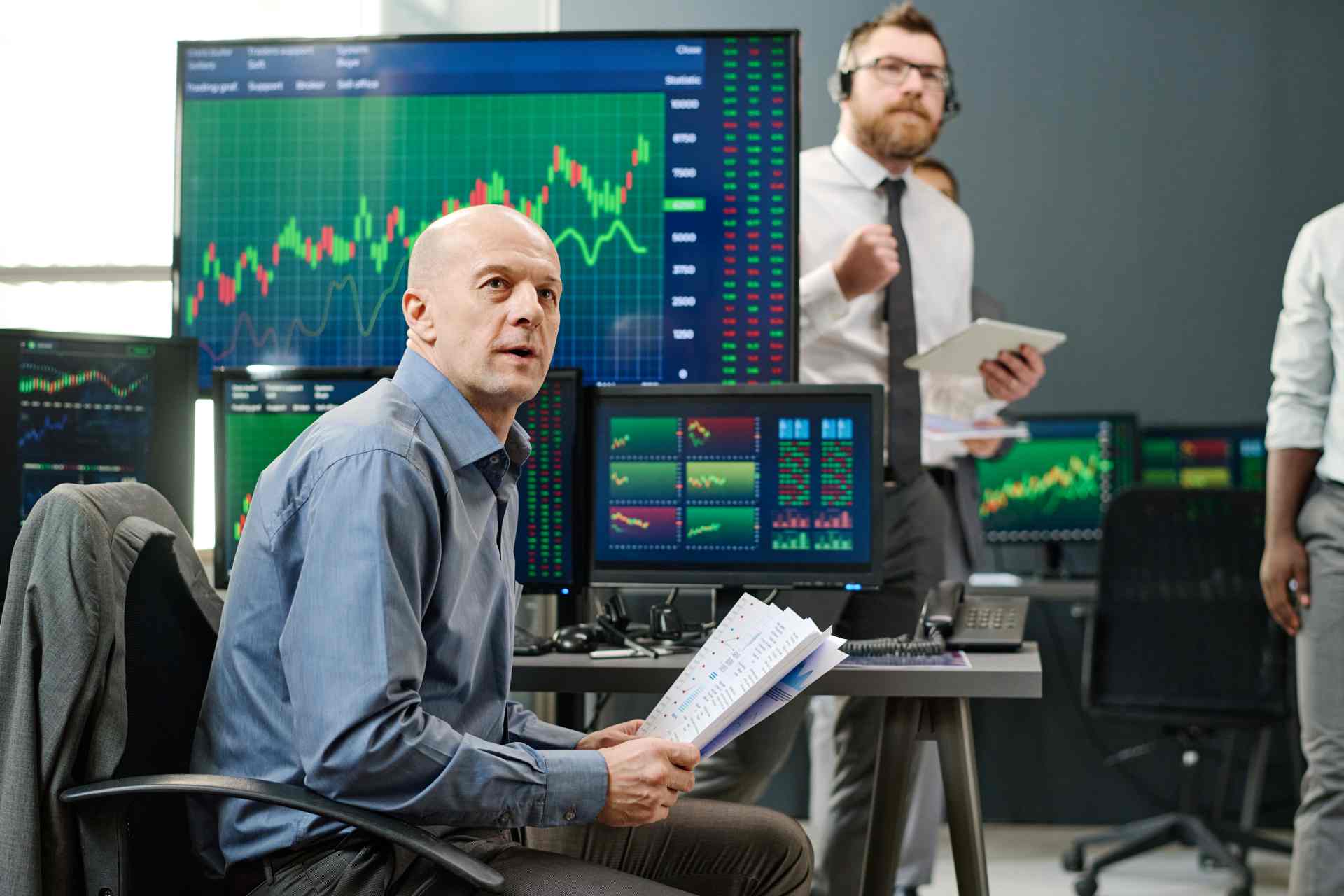 Team analyze stock market data in modern office 2026 01 09 00 29 13 utc