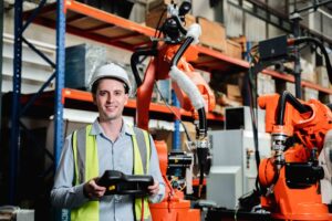 Engineer in front of automated operations machine