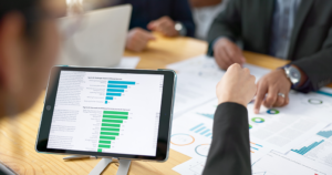 Business team reviewing AI agent performance metrics and workflow automation analytics on tablet
