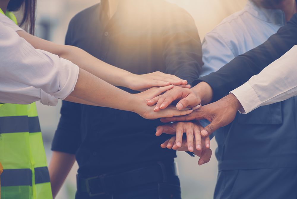 Diverse team of professionals collaborating on an AI Governance Platform